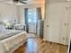 Bright bedroom with a ceiling fan, desk with chair, and decorative window with curtains at 5295 Andes St, Denver, CO 80249