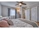 Bright bedroom with a comfortable bed, window, and closet space at 5295 Andes St, Denver, CO 80249