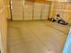 Spacious epoxy coated garage with a multi panel door, painted walls and open ceiling at 5295 Andes St, Denver, CO 80249