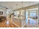 Spacious kitchen island featuring granite countertops, pendant lighting, and seating, perfect for entertaining and casual dining at 5295 Andes St, Denver, CO 80249