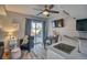 Stylish living room featuring hardwood floors and sliding door to backyard at 5295 Andes St, Denver, CO 80249