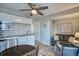 Living space with kitchen, couch, chair and a view of the outside at 5295 Andes St, Denver, CO 80249