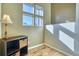 Corner office space with natural light, a storage cabinet and wood-look floors at 5295 Andes St, Denver, CO 80249