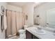 This bathroom is equipped with a shower and tub combination, a vanity and tasteful neutral decor at 1378 S Duquesne Ct, Aurora, CO 80018