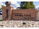 Entrance to the Murphy Creek Golf Course community, marked by a stone and brick sign and lush landscaping at 1378 S Duquesne Ct, Aurora, CO 80018