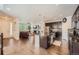 Open-concept kitchen with center island, stainless steel appliances, flowing into a cozy living area at 1378 S Duquesne Ct, Aurora, CO 80018