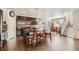 Well-equipped kitchen featuring a central island with seating, stainless steel appliances, and dark cabinets at 1378 S Duquesne Ct, Aurora, CO 80018