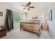 This spacious main bedroom has natural light, a ceiling fan, and a comfortable layout at 1378 S Duquesne Ct, Aurora, CO 80018