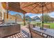 Relaxing patio with hot tub and outdoor seating under a pergola, perfect for entertaining at 1378 S Duquesne Ct, Aurora, CO 80018