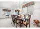 Formal dining room with traditional furniture, carpet flooring, and natural light at 5146 S Argonne St, Centennial, CO 80015