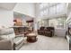 Inviting living room with soaring ceilings, a decorative window, plush furniture, and neutral carpet at 5146 S Argonne St, Centennial, CO 80015