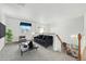 Upstairs loft area with a black sofa, a coffee table, and a view of the stairwell at 5146 S Argonne St, Centennial, CO 80015