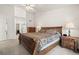 Main bedroom with bed, two nightstands, and an ensuite bathroom featuring a glass shower at 5146 S Argonne St, Centennial, CO 80015