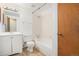 Well-lit bathroom with a shower-over-tub, and a classic single sink vanity at 2750 S Rifle St, Aurora, CO 80013