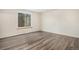 Comfortable bedroom with sleek flooring and a bright window offering natural light at 2750 S Rifle St, Aurora, CO 80013