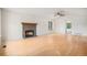 Bright living room with hardwood floors, vaulted ceiling, and a cozy stone fireplace at 2750 S Rifle St, Aurora, CO 80013