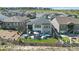 Modern home featuring an outdoor patio with furniture, a hot tub, and a fenced-in backyard at 2144 Bellcove Dr, Castle Pines, CO 80108