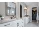 Elegant bathroom with double vanities, walk-in shower, and modern lighting at 2144 Bellcove Dr, Castle Pines, CO 80108