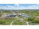 Aerial view of the community center featuring a pool, clubhouse, and well-maintained green spaces at 2144 Bellcove Dr, Castle Pines, CO 80108
