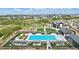 Community pool with ample seating, sunshades, and well-maintained landscaping for relaxation and recreation at 2144 Bellcove Dr, Castle Pines, CO 80108