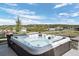 Outdoor hot tub with views of the surrounding landscape, perfect for relaxing and unwinding at 2144 Bellcove Dr, Castle Pines, CO 80108