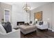 Spacious living room showcases a marble fireplace, modern lighting, and stylish decor, creating a cozy atmosphere at 2144 Bellcove Dr, Castle Pines, CO 80108