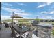 Outdoor dining area with a built-in grill, perfect for entertaining and enjoying the beautiful views at 2144 Bellcove Dr, Castle Pines, CO 80108