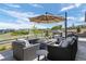 Relaxing outdoor living space with comfortable seating, a fire pit, and views of the surrounding neighborhood at 2144 Bellcove Dr, Castle Pines, CO 80108