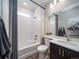 Clean bathroom with shower/tub combo, modern vanity, and updated fixtures at 5190 N Quemoy Ct, Aurora, CO 80019