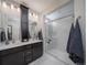 Elegant bathroom with double vanity, large shower, and modern fixtures at 5190 N Quemoy Ct, Aurora, CO 80019