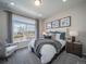 Spacious bedroom with large window, plush bedding, and ample natural light at 5190 N Quemoy Ct, Aurora, CO 80019