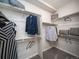 Large walk-in closet with ample shelving and hanging space at 5190 N Quemoy Ct, Aurora, CO 80019