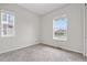 Bedroom featuring new windows, neutral walls, and carpet at 9781 Eagle River St, Littleton, CO 80125
