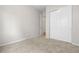 Minimalist bedroom showcases a spacious closet and a clean, neutral design at 9781 Eagle River St, Littleton, CO 80125