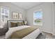 Bedroom featuring new windows, neutral walls, carpet, and furniture at 9781 Eagle River St, Littleton, CO 80125