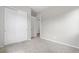 Bedroom featuring new carpet, neutral walls, and double closets at 9781 Eagle River St, Littleton, CO 80125