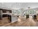 Open concept living area showcases hardwood floors, kitchen, and dining areas at 9781 Eagle River St, Littleton, CO 80125