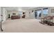 Finished basement with carpeting, large windows, and a sitting area at 1075 Whitekirk Pl, Castle Rock, CO 80104