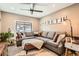 Comfortable living room featuring a large grey sectional sofa, creating a cozy spot for relaxation at 327 S Xanadu St, Aurora, CO 80012