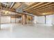 Unfinished basement featuring concrete flooring, exposed ceiling, and framed stairwell, offering potential for customization at 3475 Golden Spur Loop, Castle Rock, CO 80108