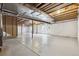 Unfinished basement featuring concrete flooring, exposed ceiling, and framed stairwell, offering potential for customization at 3475 Golden Spur Loop, Castle Rock, CO 80108
