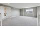 Spacious bedroom with neutral carpet, grey walls, and natural light at 3475 Golden Spur Loop, Castle Rock, CO 80108