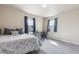 Bright bedroom with a desk near the window, and a queen-sized bed at 3475 Golden Spur Loop, Castle Rock, CO 80108