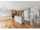 This open kitchen offers stainless steel appliances, wood cabinets, and an island at 3475 Golden Spur Loop, Castle Rock, CO 80108