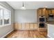 This kitchen has built in cabinets, stainless steel double ovens, and wood floors at 3475 Golden Spur Loop, Castle Rock, CO 80108