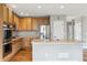 Spacious kitchen features stainless steel appliances and wood cabinets at 3475 Golden Spur Loop, Castle Rock, CO 80108