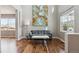 Spacious living room with hardwood floors, a large window, and modern decor at 3475 Golden Spur Loop, Castle Rock, CO 80108