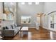 Bright living room boasting vaulted ceilings, hardwood floors, and oversized windows at 3475 Golden Spur Loop, Castle Rock, CO 80108