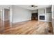 The light-filled living room features a fireplace and wood flooring at 3475 Golden Spur Loop, Castle Rock, CO 80108