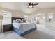 Spacious main bedroom featuring high vaulted ceilings, plush gray carpet, and adjoining sitting area at 3475 Golden Spur Loop, Castle Rock, CO 80108